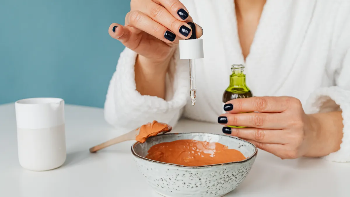 person mixing a DIY face mask in a bowl